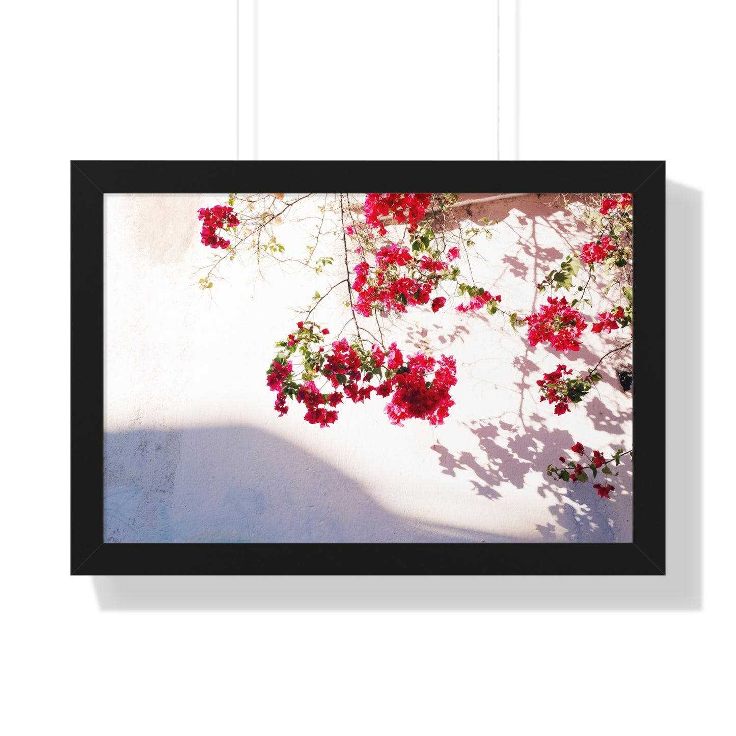 Photography art titled "Alleyway Roses." The framed photography wall art depicted is 24"x16" and is pictured in a black frame option. 

Photo of pink flowers in golden light. 

Mexico Print Series. Oaxaca, Mexico, 2024.

Original photography artwork by Nick Sparks.  