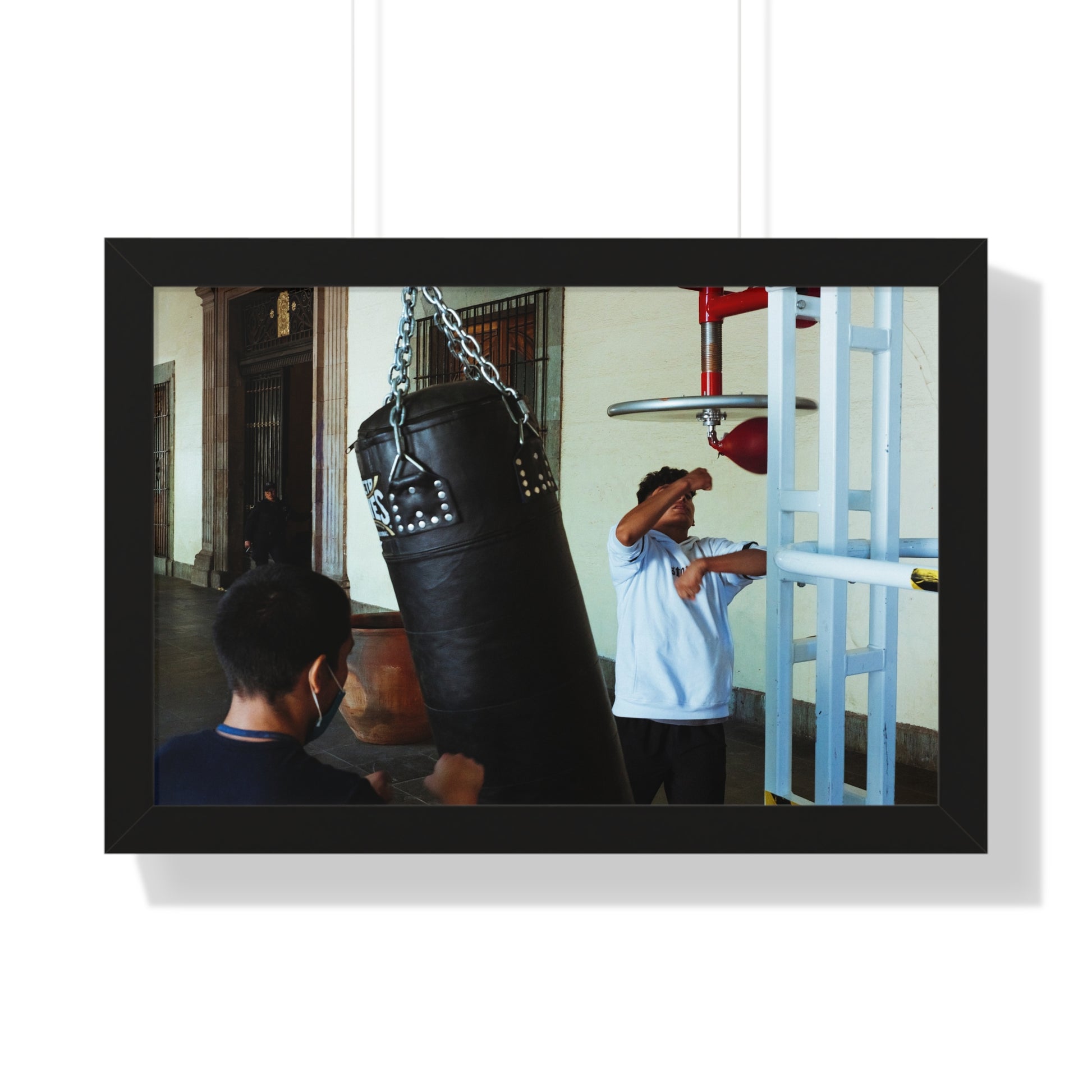 Photography art titled “Boys Boxing.” The framed photography wall art depicted is 24"x16" and is pictured in a black frame option. 

Photo of two boys boxing outdoors.

Mexico Print Series. Oaxaca, Mexico, 2024.

Original photography artwork by Nick Sparks.  