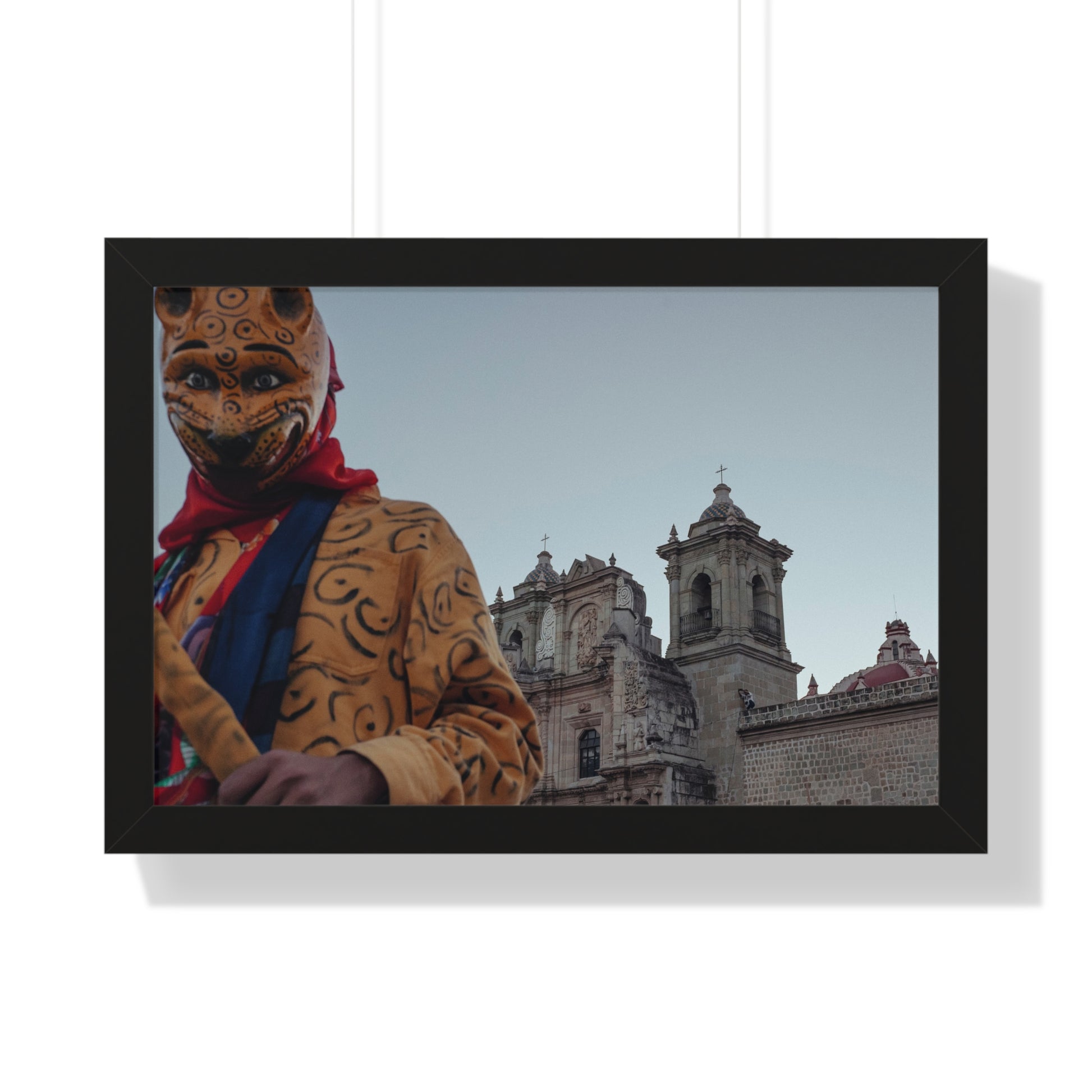 Photography art titled “Centro Celebration.” The framed photography wall art depicted is 24"x16" and is pictured in a black frame option. 

A person dancing in a jaguar costume in front of a church during a Oaxacan celebration.

Mexico Print Series. Oaxaca, Mexico, 2024.

Original photography artwork by Nick Sparks.  