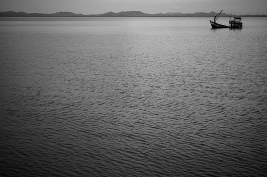 Photographic Art by Nick Sparks of a sunken boat in northern Thailand. 